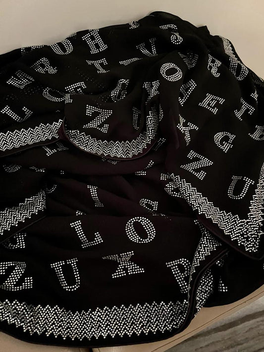 Alphabetic inspired black Swarovski saree