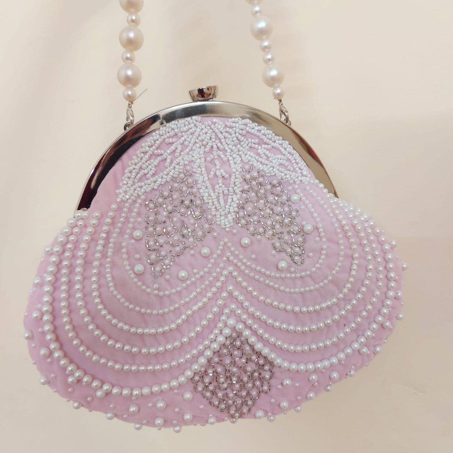 Rishika embroidered pearl clutch