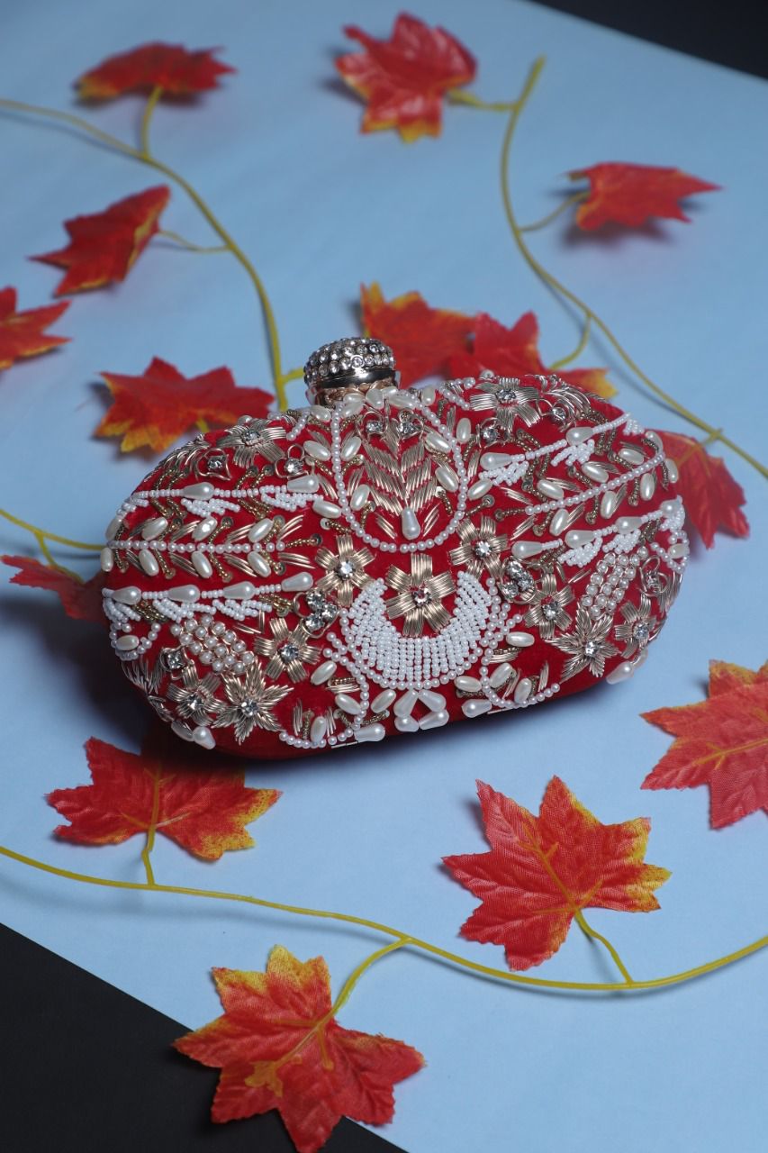 Embroidered oval clutch